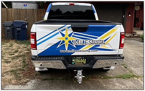 Tailgate shot of the Miles Security work truck
