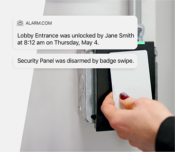 Employee holding badge card to access office