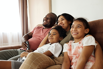Smiling family feeling secure at home